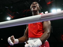 Boxer Cindy Ngamba Wins Refugee Olympic Team's First Medal Ever