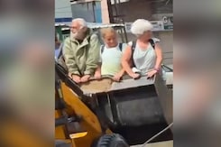 Video: Flood Tourism? Foreigners Taken On Bulldozer Ride In Vadodara Video: Flood Tourism? Foreigners Taken On Bulldozer Ride In Vadodara