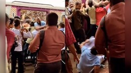 Man Is Seen Fighting To Get Down From Mumbai Local, Video Goes Viral