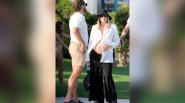 Margot Robbie's Take On Maternity Fashion Came In A Bump-Baring White Shirt With Black Flared Pants