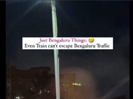 Bengaluru Train Viral Video: जब ट्रैफिक में फंसी ट्रेन तो लोग हुए हैरान, सोशल मीडिया पर वायरल हुआ वीडियो तब रेलवे ने बताई सच्चाई