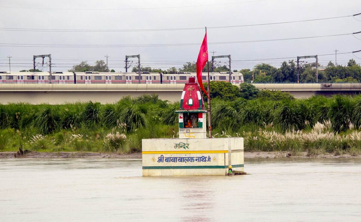 A temple submerged in the rising Yamuna river. (IANS) A temple submerged in the rising Yamuna river. (IANS)