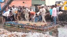 Video: Cops Try To Destroy Liquor Bottles With Bulldozer, Locals Steal Them