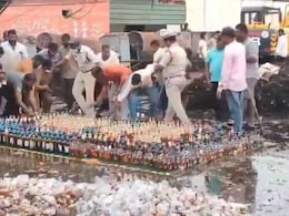 Video: Cops Try To Destroy Liquor Bottles With Bulldozer, Locals Steal Them Video: Cops Try To Destroy Liquor Bottles With Bulldozer, Locals Steal Them