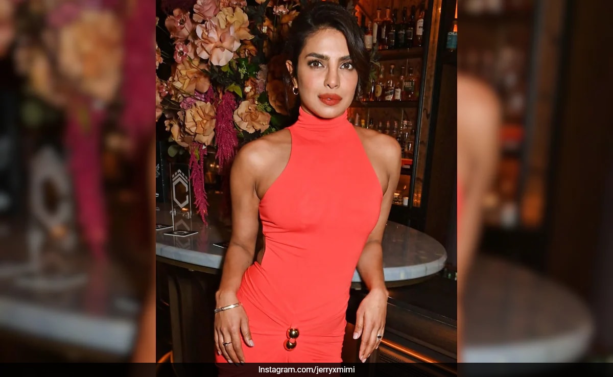priyanka chopra orange dress Priyanka Chopra's Electrifying Look in Sexy Plunging Neckline Orange Dress