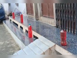 Rajasthan:  राजस्थान के इस गांव में हर घर के गेट पर रखी हैं लाल-नीली बोतलें, इस टोटके से अचरज में पड़े लोग Rajasthan:  राजस्थान के इस गांव में हर घर के गेट पर रखी हैं लाल-नीली बोतलें, इस टोटके से अचरज में पड़े लोग