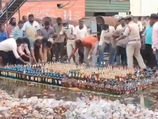 Video: Cops Try To Destroy Liquor Bottles With Bulldozer, Locals Steal Them