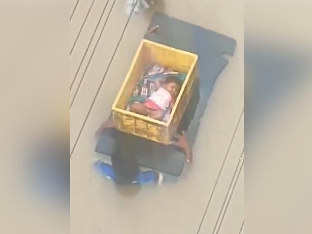Baby In Plastic Crate Carried By Men In Andhra Flood Waters