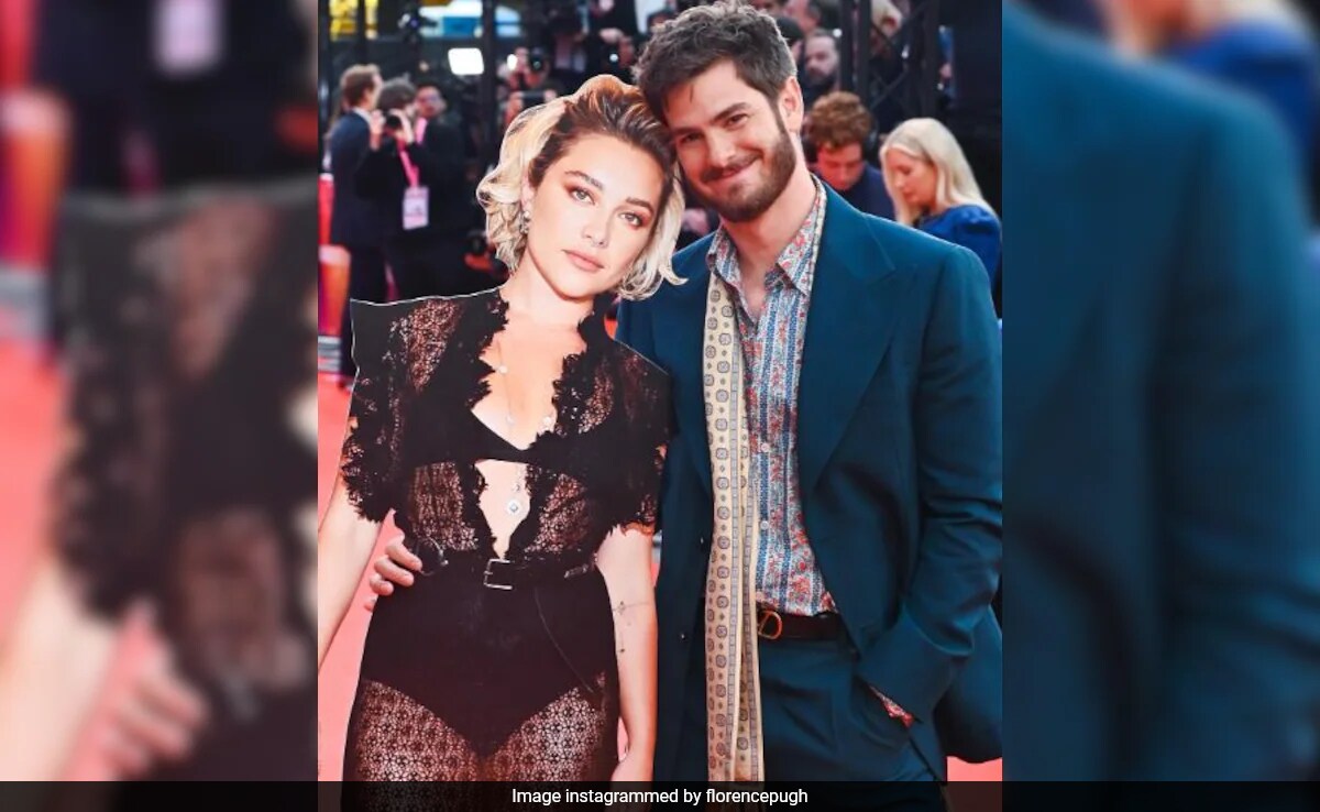 At <i>We Live In Time</i> Premiere, Andrew Garfield's Plus One Was A Giant Cutout Of Florence Pugh. Talk About Chemistry