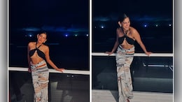 Kubbra Sait's Holiday Style In A Black Bralette And Printed Skirt Was Totally "On Point"