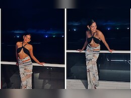 Kubbra Sait's Holiday Style In A Black Bralette And Printed Skirt Was Totally "On Point"