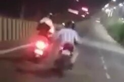 Man Riding Bike Harasses Woman On Scooter In Lucknow Man Riding Bike Harasses Woman On Scooter In Lucknow