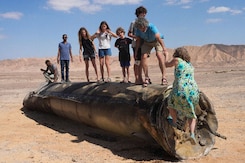People Take Photos With Debris Of Intercepted Iranian Missiles In Israel
