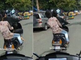 सड़क पर स्कूटी चला नहीं उड़ा रहे थे लड़के, पीछे वाले ने कैमरे में रिकॉर्ड किया बच्चों का स्टंट, वायरल हुआ बेंगलुरु का Video सड़क पर स्कूटी चला नहीं उड़ा रहे थे लड़के, पीछे वाले ने कैमरे में रिकॉर्ड किया बच्चों का स्टंट, वायरल हुआ बेंगलुरु का Video
