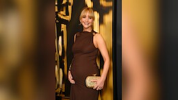 Mother-To-Be Jennifer Lawrence Donned A Draped Gown With Gold Accents That Had Her Baby Bump On Display