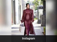 megan fox showcased her baby bump in a sheer dress. shows off red gown at LA event Megan Fox's First Maternity Outfit