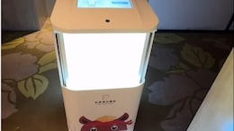 "Another Person Out Of Work!" Internet Reacts As Vlogger Gets Food Delivered By A Robot In China