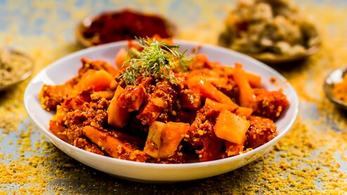 Will Eating Spicy Achaar With Parathas Give You Gas And Bloating In Winter? Here's What To Check