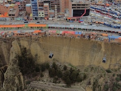 Bolivia's Gravity-Defying 'Suicide Homes' Dangle On A Cliff