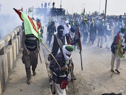 Hit By Tear Gas, Water Cannons, Farmers Stop March to Delhi Midway Hit By Tear Gas, Water Cannons, Farmers Stop March to Delhi Midway