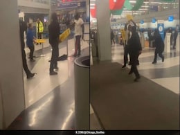 Video: Chaos Erupts At Chicago Airport As People Clash Using 'Wet Floor' Signs Video: Chaos Erupts At Chicago Airport As People Clash Using 'Wet Floor' Signs