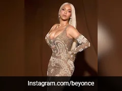 Beyonce Spreads Her Golden Glow In A Gilded Gown With Paisley And Pearl Details