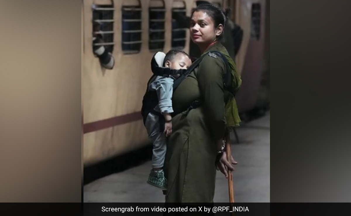 Baby Strapped To Chest, Baton In Hand: RPF Officer Patrols At Railway Station
