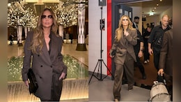 Jennifer Lopez Does "Business Trip" Stylishly In A Chic Brown Oversized Pantsuit