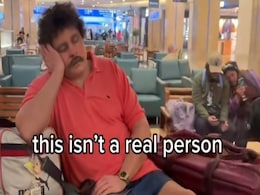 Watch: Florida Airport Has A Hyper-Realistic Sleeping 'Traveller' Statue Watch: Florida Airport Has A Hyper-Realistic Sleeping 'Traveller' Statue