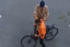 Video: Cop Slaps Boy, Pulls Hair For Cycling During PM Convoy Rehearsal Video: Cop Slaps Boy, Pulls Hair For Cycling During PM Convoy Rehearsal