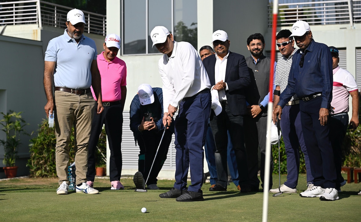 Pranav Adani putting on the greens Pranav Adani putting on the greens