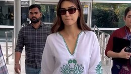 Kriti Sanon Aces Her Airport Fashion In White Embroidered <i>Kurta</i> Set
