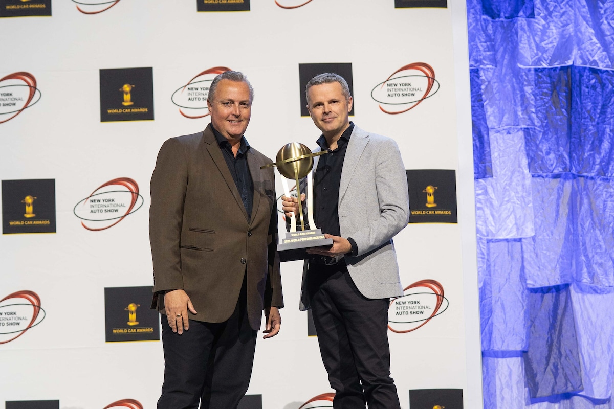 Angus Fitton, Vice-President of PR at PCNA receiving the award from Steve Fowler of World Car Awards
