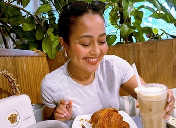 Neha Kakkar Enjoys Croissants At Cafe, Spills Coffee While Laughing Hard Neha Kakkar Enjoys Croissants At Cafe, Spills Coffee While Laughing Hard