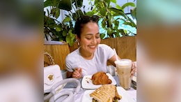 Neha Kakkar Enjoys Croissants At Cafe, Spills Coffee While Laughing Hard