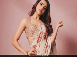 Samantha Ruth Prabhu Drapes A Beige Chiffon <i>Saree</i> With Bursts Of Printed Red Blooms Samantha Ruth Prabhu Drapes A Beige Chiffon <i>Saree</i> With Bursts Of Printed Red Blooms