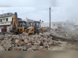 Rajasthan: भरतपुर में कब्रिस्तान पर चला बुलडोजर, दीवार तोड़कर हटाया अतिक्रमण  Rajasthan: भरतपुर में कब्रिस्तान पर चला बुलडोजर, दीवार तोड़कर हटाया अतिक्रमण