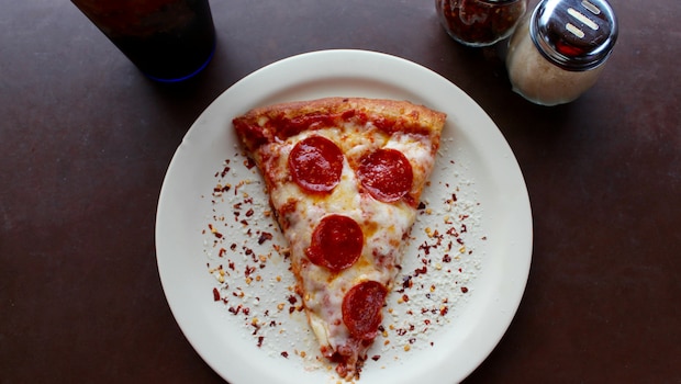 A slice of leftover pizza can delight a true pizza fan. A slice of leftover pizza can delight a true pizza fan.