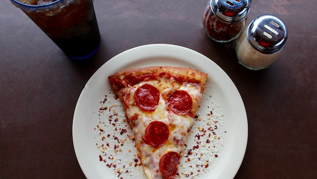 A slice of leftover pizza can delight a true pizza fan.