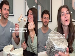 Couple Tries One Year Old Frozen Wedding Cake, Husband's Reaction Goes Viral Couple Tries One Year Old Frozen Wedding Cake, Husband's Reaction Goes Viral