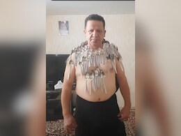 Watch: Man Breaks His Own Record By Balancing 96 Spoons On His Body