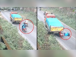 Video: Truck Rolls Back On Slope, Misses Woman On Scooter By Inches Video: Truck Rolls Back On Slope, Misses Woman On Scooter By Inches