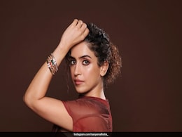 Sanya Malhotra Powers Through The Week In A Rust Lycra Skirt Set With Drape Sanya Malhotra Powers Through The Week In A Rust Lycra Skirt Set With Drape