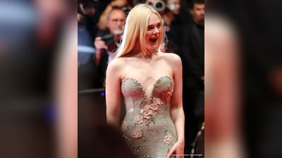 elle fanning green dress cannes Elle Fanning looked glamorous in a shimmering green gown adorned with white flowers by #GiorgioArmani at the 2025 #CannesFilmFestival in Cannes Yes or No ??