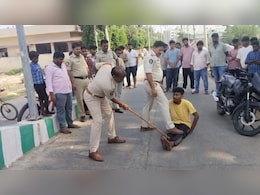 Video: 3 Men Made To Sit On Road As Andhra Cops Hit Them With Sticks Video: 3 Men Made To Sit On Road As Andhra Cops Hit Them With Sticks