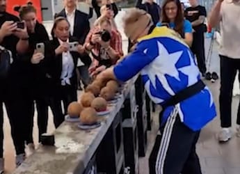 Man Smashes 48 Coconuts With One Hand While Blindfolded To Set A World Record Man Smashes 48 Coconuts With One Hand While Blindfolded To Set A World Record