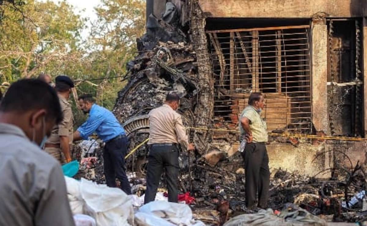 A forensic team at the crash site on Friday. A forensic team at the crash site on Friday.