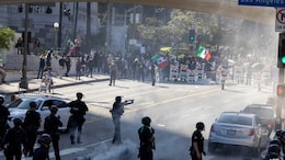 In Pics: Burning Cars, Tear Gas At Los Angeles Anti-Immigration Protests