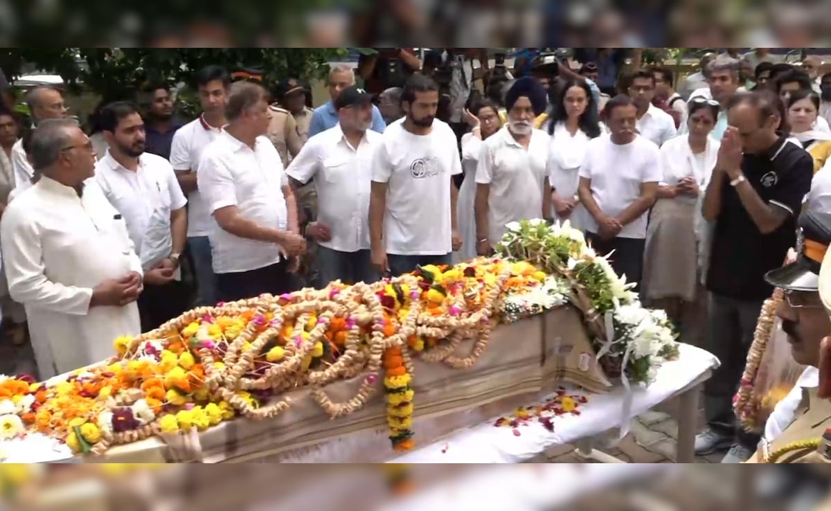His family members, friends, neighbours, and colleagues assembled to bid a final goodbye. His family members, friends, neighbours, and colleagues assembled to bid a final goodbye.