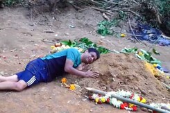 "I Want To Stay Here Too": Father Holds On To Grave Of Son Killed In Stampede "I Want To Stay Here Too": Father Holds On To Grave Of Son Killed In Stampede